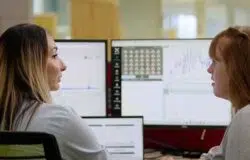 Monitoring engineers discussing data small