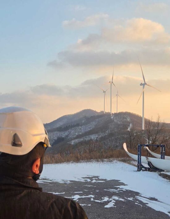 Onyx engineer looking at onshore turbines