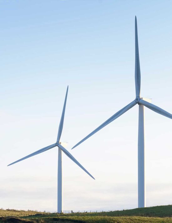 Two wind turbines on hill square